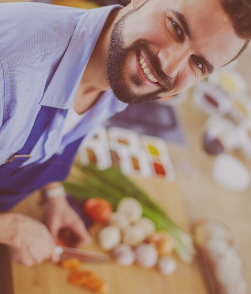 Man preparing delicious and healthy food in the home kitchen