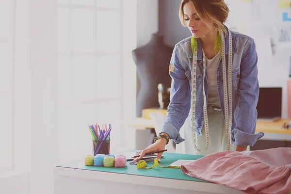 Fashion designer woman working on her designs in the studio — Stock Photo, Image