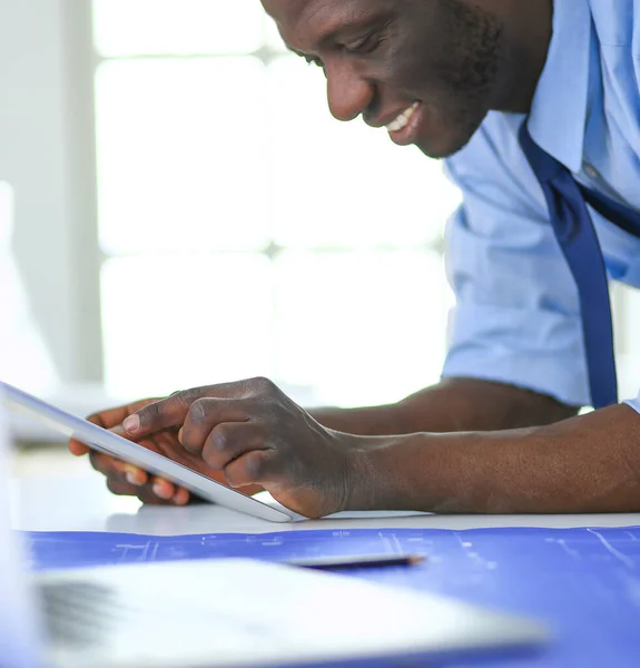 African american architect working with computer and blueprints in office — Stock Photo, Image