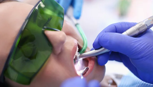 Dental team and patient at dentists surgery