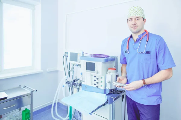 Male surgeon on background in operation room Stock Image