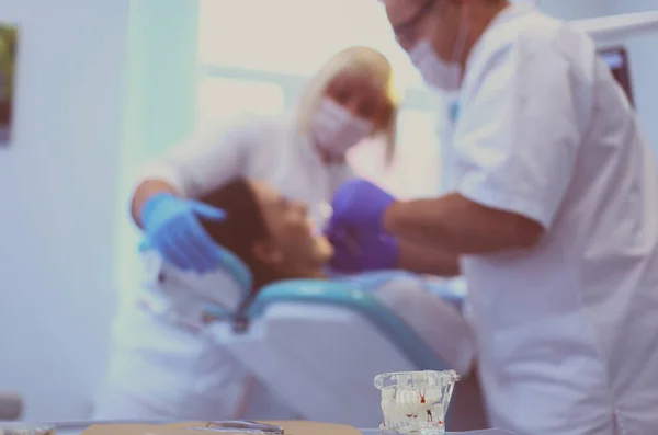 Dentist man with patient woman in clinic — Stock Photo, Image