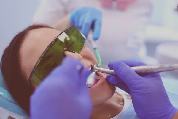 Dental team and patient at dentists surgery — Stock Photo, Image