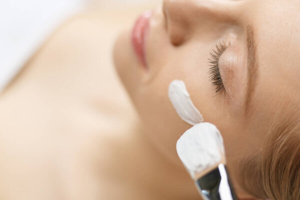 Spa facial mask application. Spa beauty organic facial mask application at day spa salon