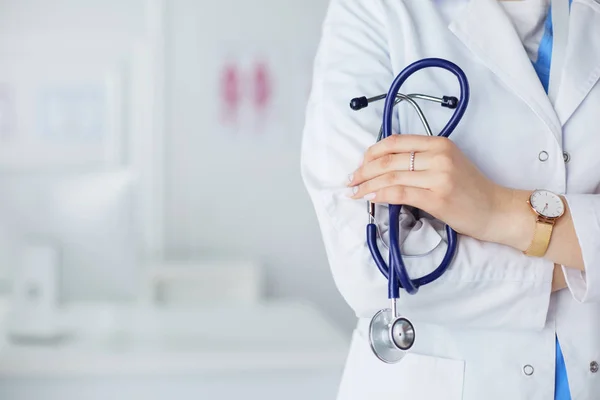 Smiling medical doctor woman with stethoscope in hospital — Stock Photo, Image