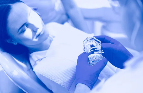 Beautiful senior woman at dentist having dental treatment at dentists office — Stock Photo, Image