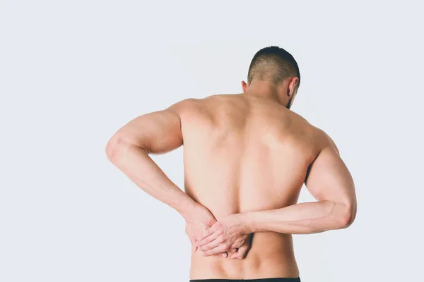 Joven sosteniendo su cuello con dolor. Concepto médico —  Fotos de Stock