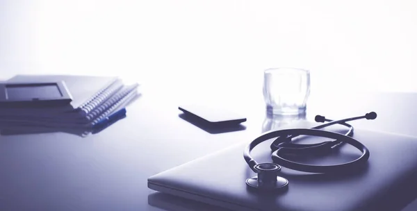 Workplace of doctor with laptop and stethoscope and notebook — Stock Photo, Image