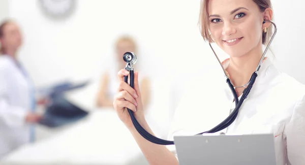 A female doctor with a stethoscope listening — Stock Photo, Image