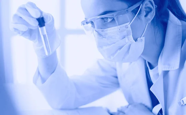 Researcher, doctor, scientist or laboratory assistant working with plastic medical tubes in modern lab or hospital — Stock Photo, Image