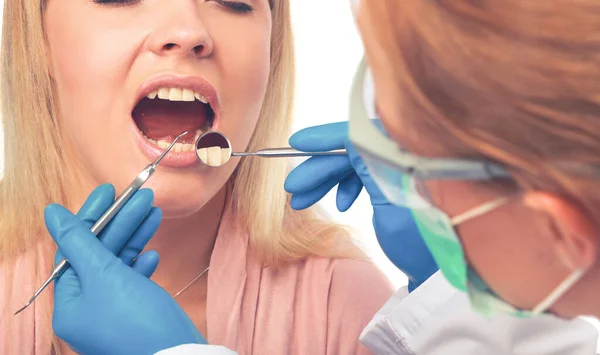 Young woman dentist at work in the office — Stock Photo, Image