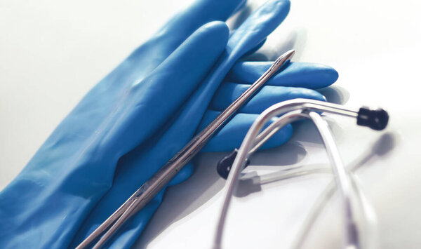 Medical glove and a stethoscope