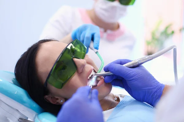 Dental team and patient at dentists surgery — Stock Photo, Image