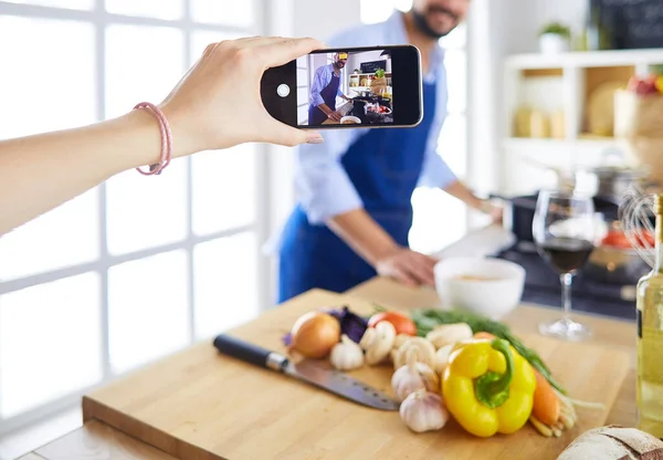 Portrait of handsome man filming cooking show or blog — Stock Photo, Image