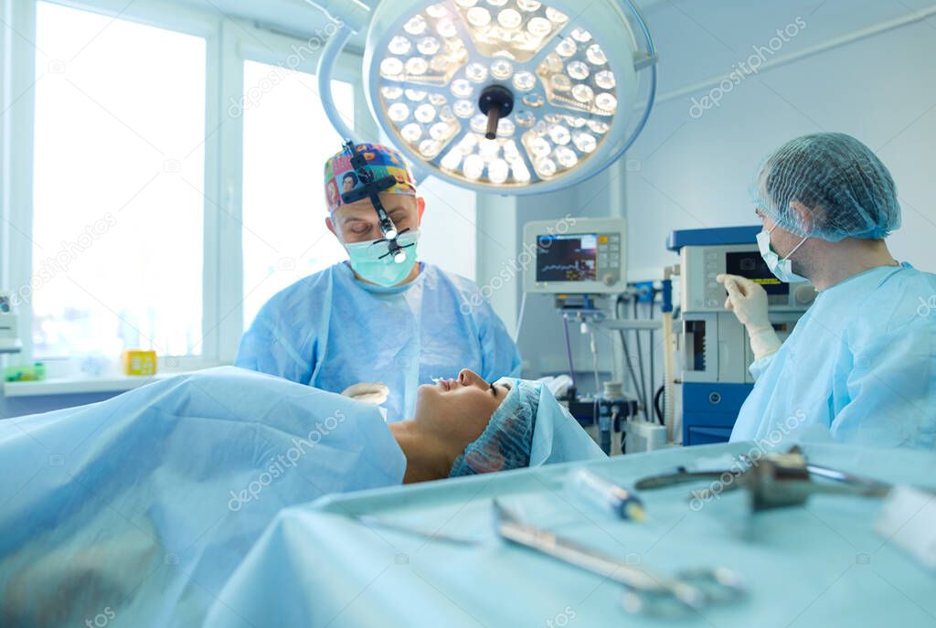 Man surgeon at work in operating room