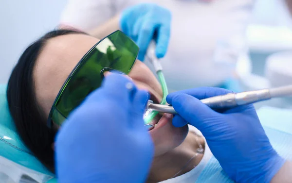 Dental team and patient at dentists surgery — Stock Photo, Image