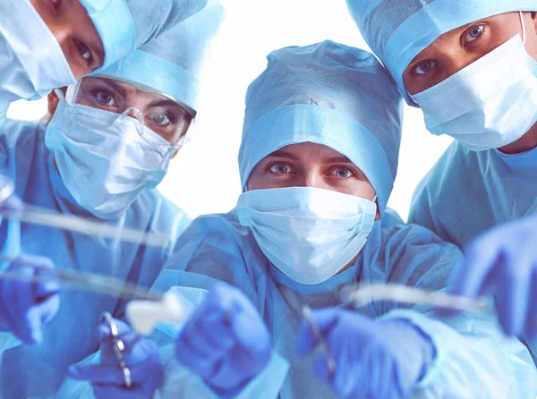 Below view of surgeons holding medical instruments in hands — Stock Photo, Image