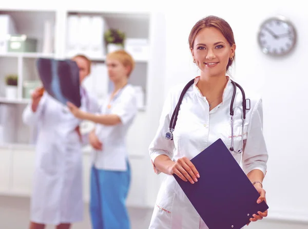 Portrait of woman doctor at hospital with folder — Stock Photo, Image