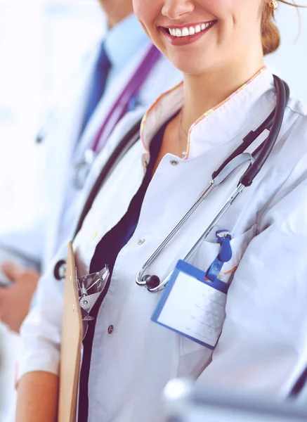 Woman doctor standing with stethoscope at hospital — Stock Photo, Image