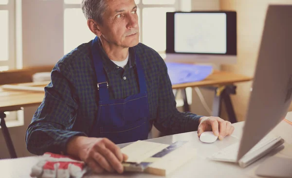 Architect working on drawing table in office