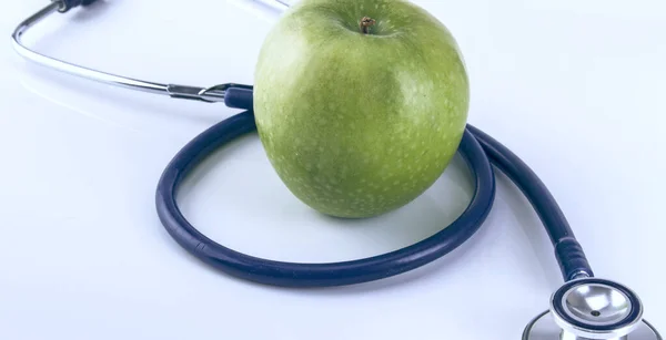 Medical stethoscope and apple isolated on white background — Stock Photo, Image