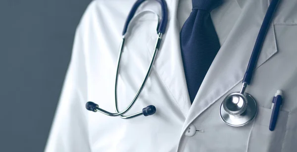 Young and confident male doctor portrait standing in medical office — Stock Photo, Image