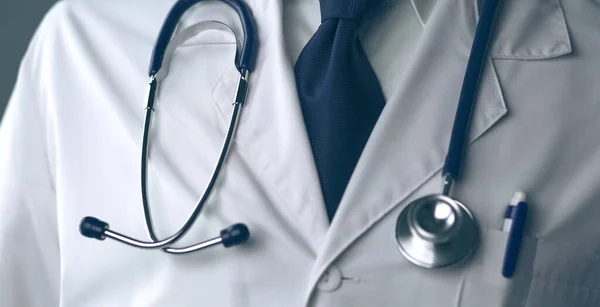 Young and confident male doctor portrait standing in medical office — Stock Photo, Image