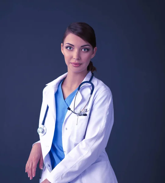 Doctor woman with stethoscope isolated on grey background — Stock Photo, Image