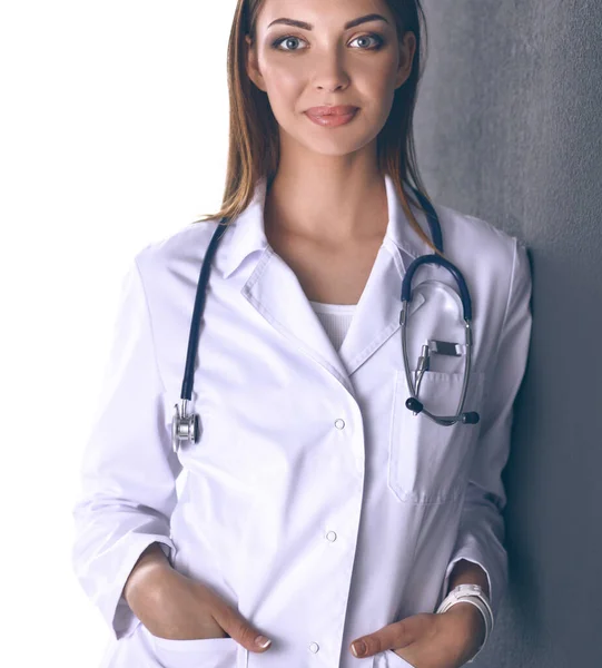 Doctor woman with stethoscope isolated on grey background — Stock Photo, Image