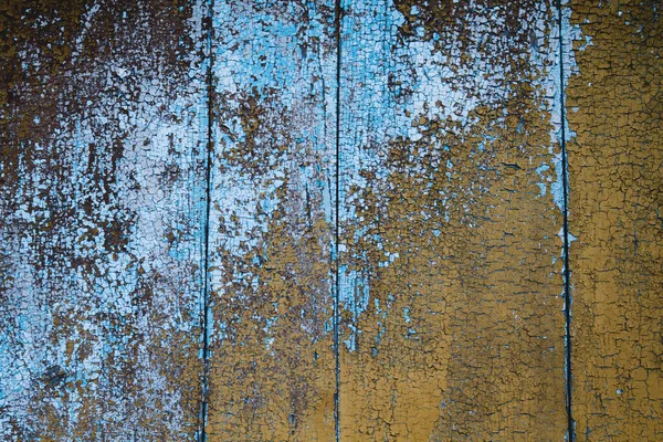Oude houten muur met blauwe en bruine verf — Stockfoto