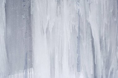 Yüzeyde beyaz ve mavi boya damlıyor, soyut arkaplan 