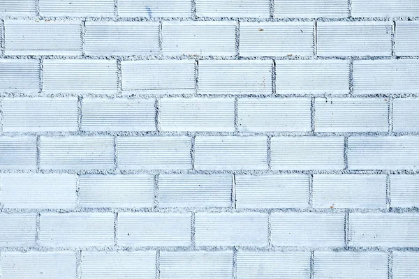 Blue painted brick wall