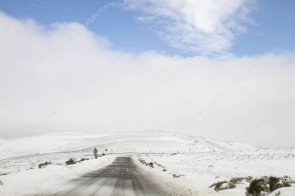 A road in the white snowy mountains 