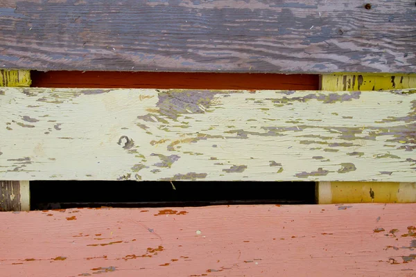 Old colorful wooden pallet with distrssed paint