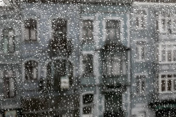 Rain droplets in a window glass in Brussels