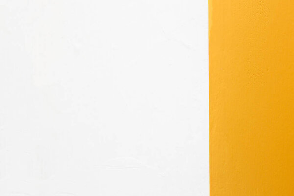 Texture of a white wall and indian orange