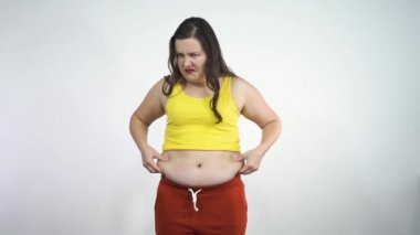 Fat girl touches her belly and aggressively shows fuck to the camera
