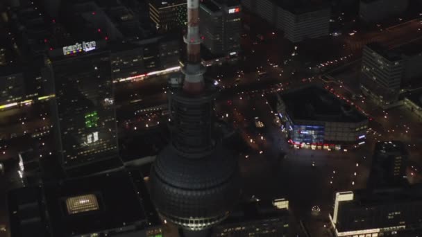 AERIAL: Over Berlin Germany TV Tower Alexanderplatz at Night with City Lights traffic — Stock Video