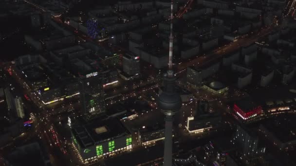 AERIAL: Over Berlin Germany TV Tower Alexanderplatz at Night with City Lights traffic — Stock video