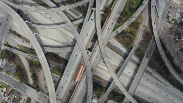 AERIAL: Peracular Turning Overhead of Judge Pregerson Highway show multiple Roads, Bridges, Viaducts with little car traffic in Los Angeles, California on Beautiful Sunny Day — 비디오