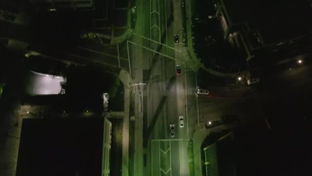 AERIAL: Lookup over Wilshire Boulevard Street in Hollywood Los Angeles at Night with View on Streets and City Car Traffic Lights — Stock Video