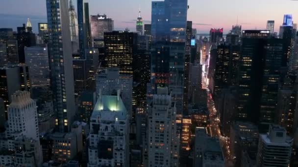 AERIAL: Manhattan Skyline at night with flashing City lights in New York City at Central Park — Stock Video