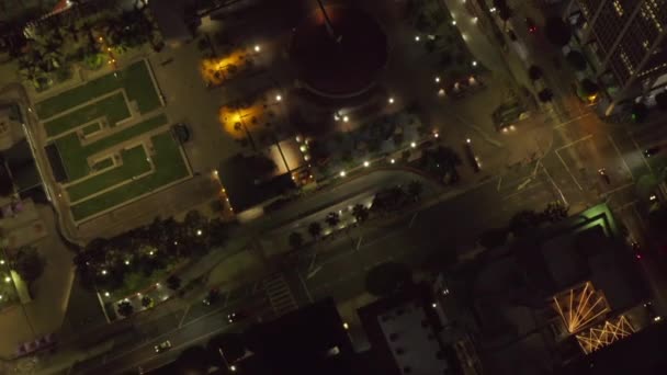 AERIAL: Birds View flight over pershing square in Downtown Los Angeles, California at Night, glowing city lights — Stock Video