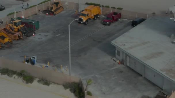 AERIAL: Flight over beach with voleyball nets at Venice Beach with palm trees and bike lane, Sunny, Los Angeles California — Stock video