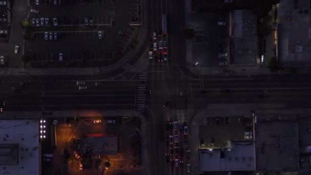 AERIAL: Bird eye view of Culver City, Los Angeles, California traffic, interesting resction at evening with car traffic passing and parking lot — 图库视频影像