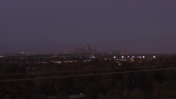 AERIAL: Wide view of Downtown Los Angeles, California Skyline from Culver City at Dusk, Night with Purple Sky — 비디오