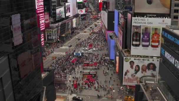 AERIAL: Close up flight over Times Square heart of New York City at Daylight with crowd of people and heavy car traffic — Stock Video