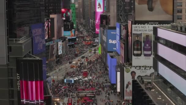 AERIAL: Close up flight over Times Square heart of New York City at Daylight with crowd of people and heavy car traffic — Stock Video