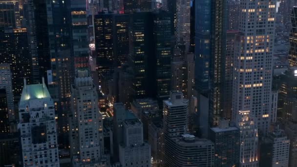 AERIAL: Manhattan Skyline at night with flashing City lights in New York City at Central Park — Stock Video