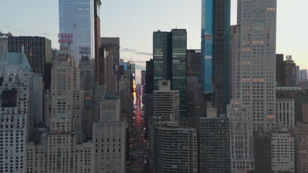 AERIAL: View of 7th Avenue Traffic and Times Square over New York City Central Park at Sunset with City lights — Stock Video